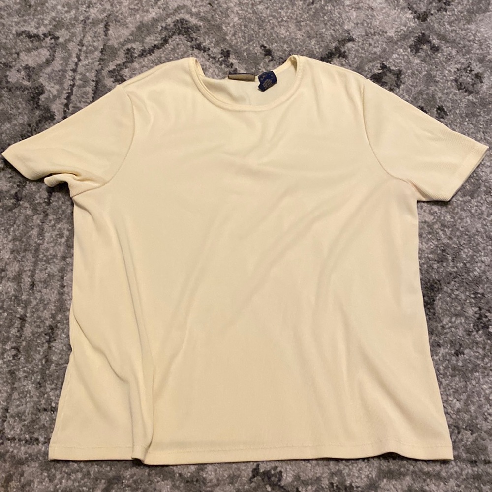 Soft yellow top, 95% Polyester, 5% Spandex.